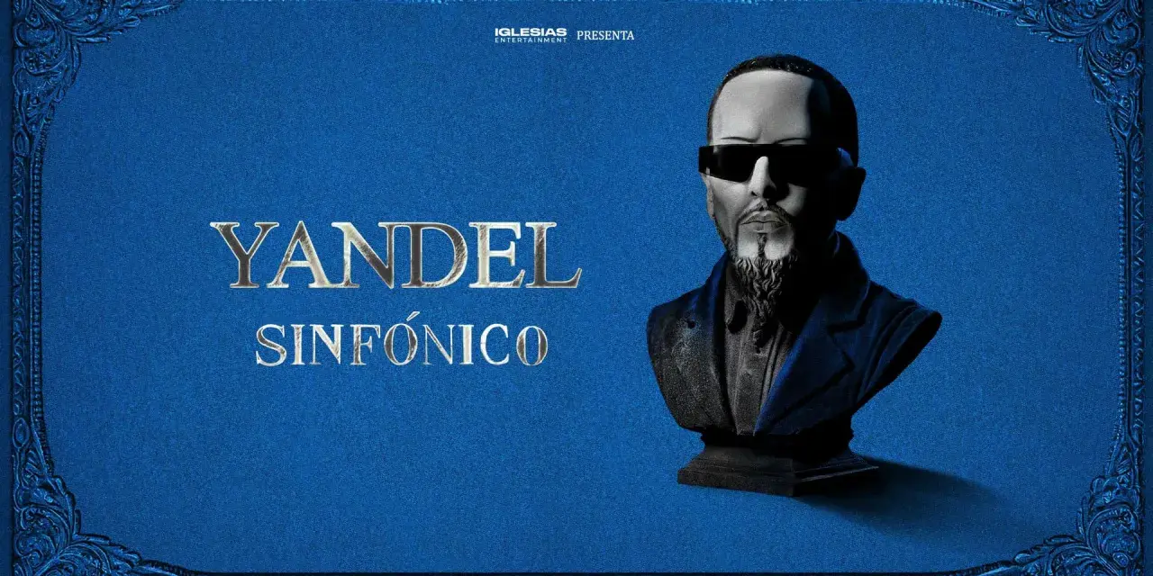 Yandel Sinfónico, un busto del artista con gafas oscuras y barba, sobre un fondo azul texturizado con adornos dorados. Iglesias Entertainment presenta.