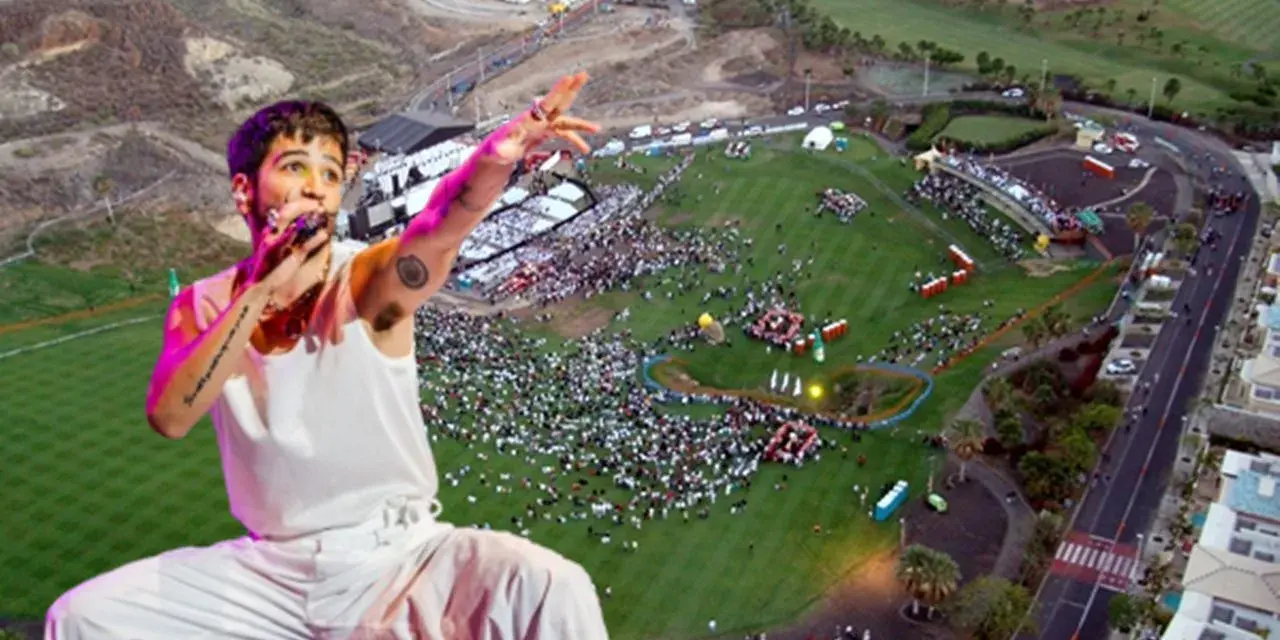 Camilo canta en un multitudinario concierto al aire libre. El artista, con su característico estilo, domina el escenario ante miles de fans.