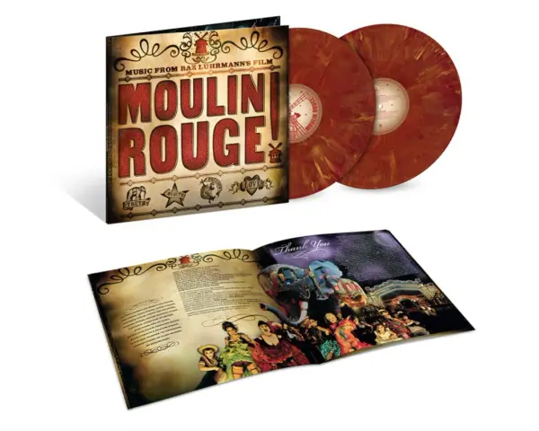 Vinilos de las canciones de Moulin Rouge! con su funda y libreto abierto mostrando imágenes del espectáculo.