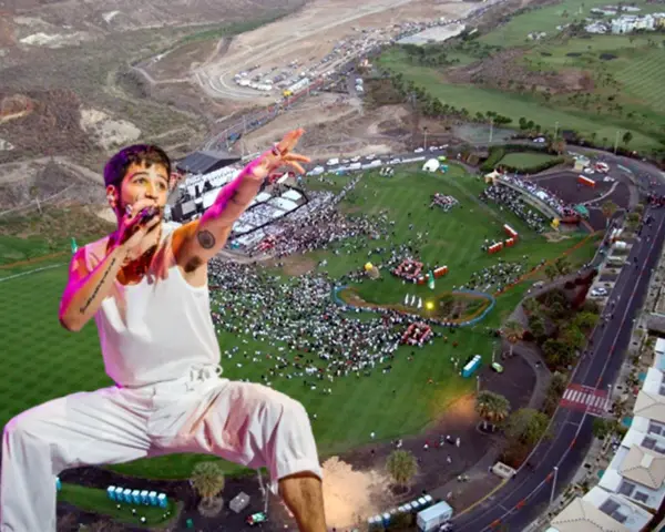 Camilo canta en un multitudinario concierto al aire libre. El artista, con su característico estilo, domina el escenario ante miles de fans.